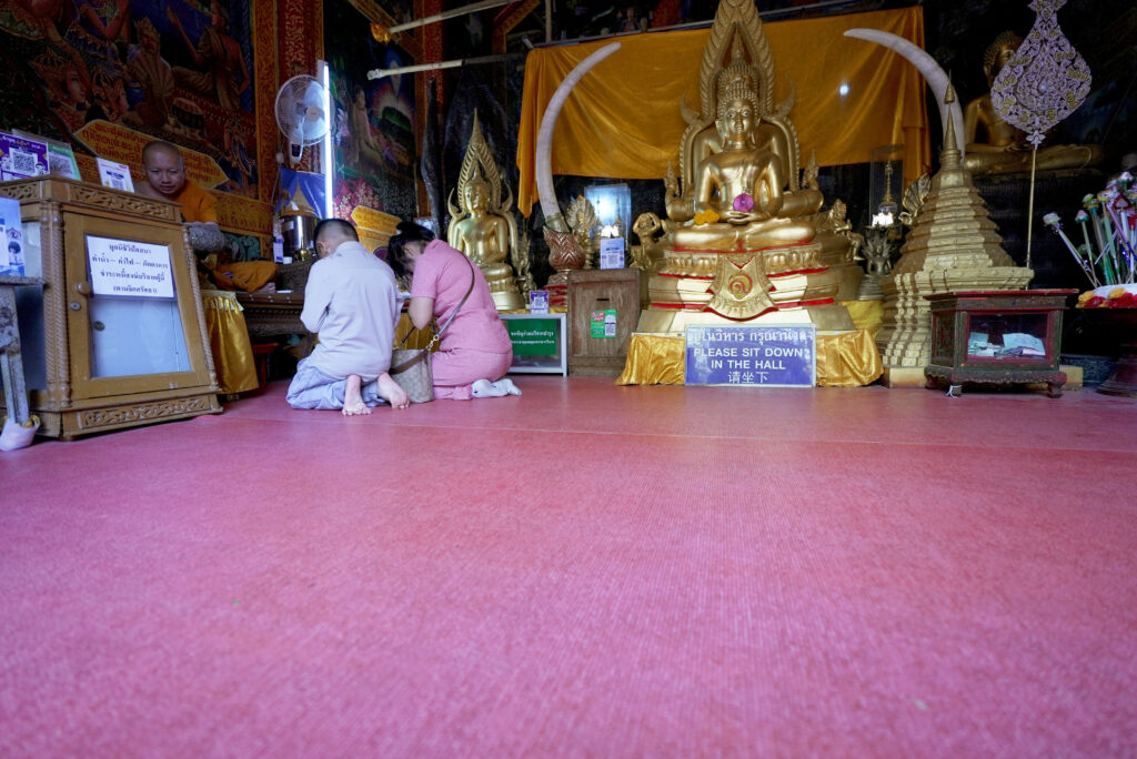 Blessings from a Buddhist monk at Wat Phra That Doi Suthep Temple.